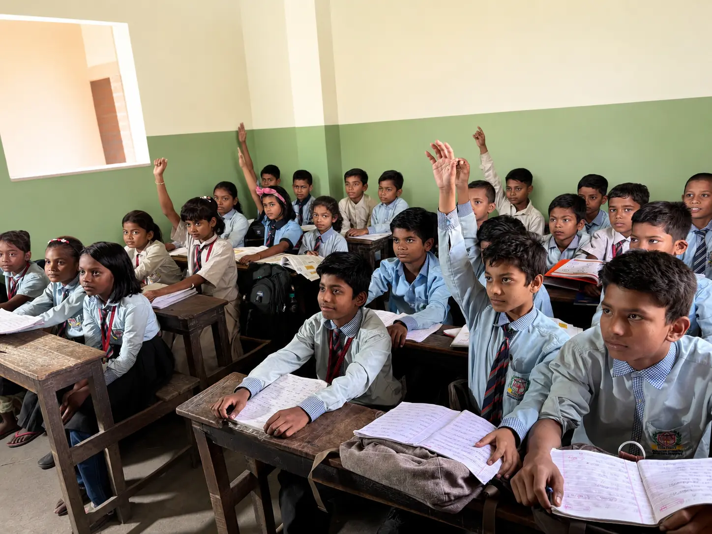 Students in class with asking question by teachers